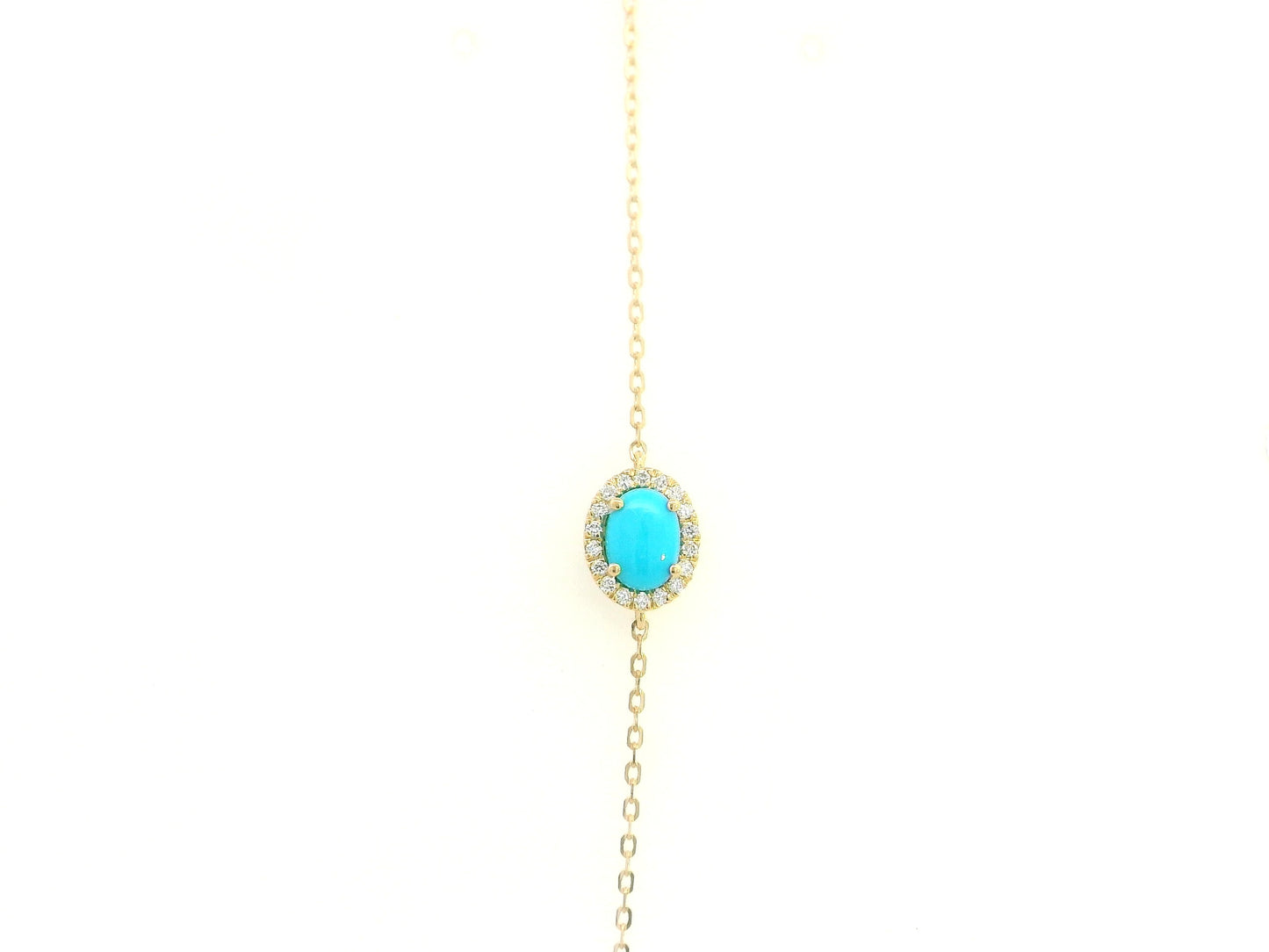 Turquoise diamond halo bracelet in 18K yellow gold with delicate chain by Emirates Diamonds