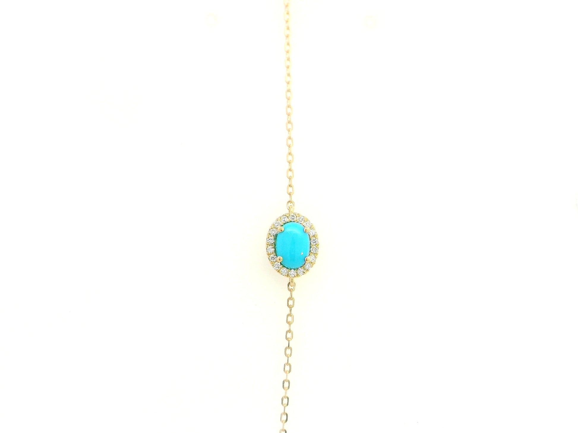 Turquoise diamond halo bracelet in 18K yellow gold with delicate chain by Emirates Diamonds