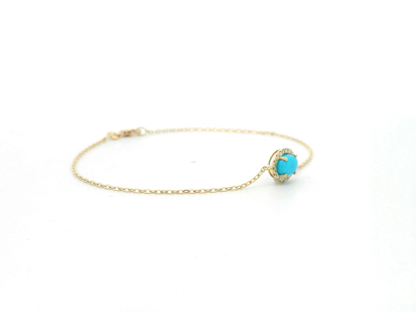 Turquoise diamond halo bracelet in 18K yellow gold with delicate chain by Emirates Diamonds