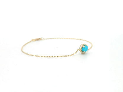 Turquoise diamond halo bracelet in 18K yellow gold with delicate chain by Emirates Diamonds