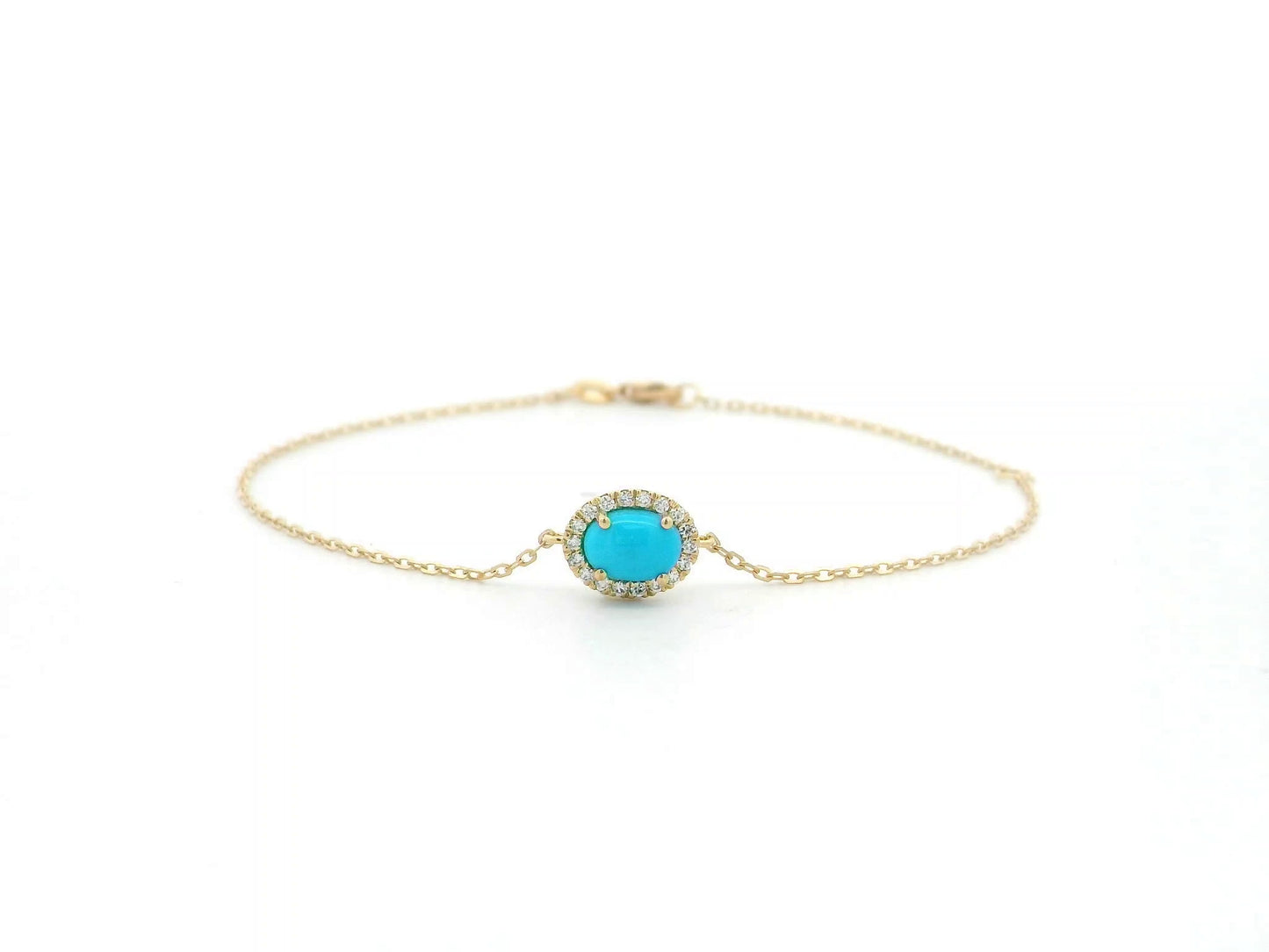 Turquoise diamond halo bracelet in 18K yellow gold with delicate chain by Emirates Diamonds