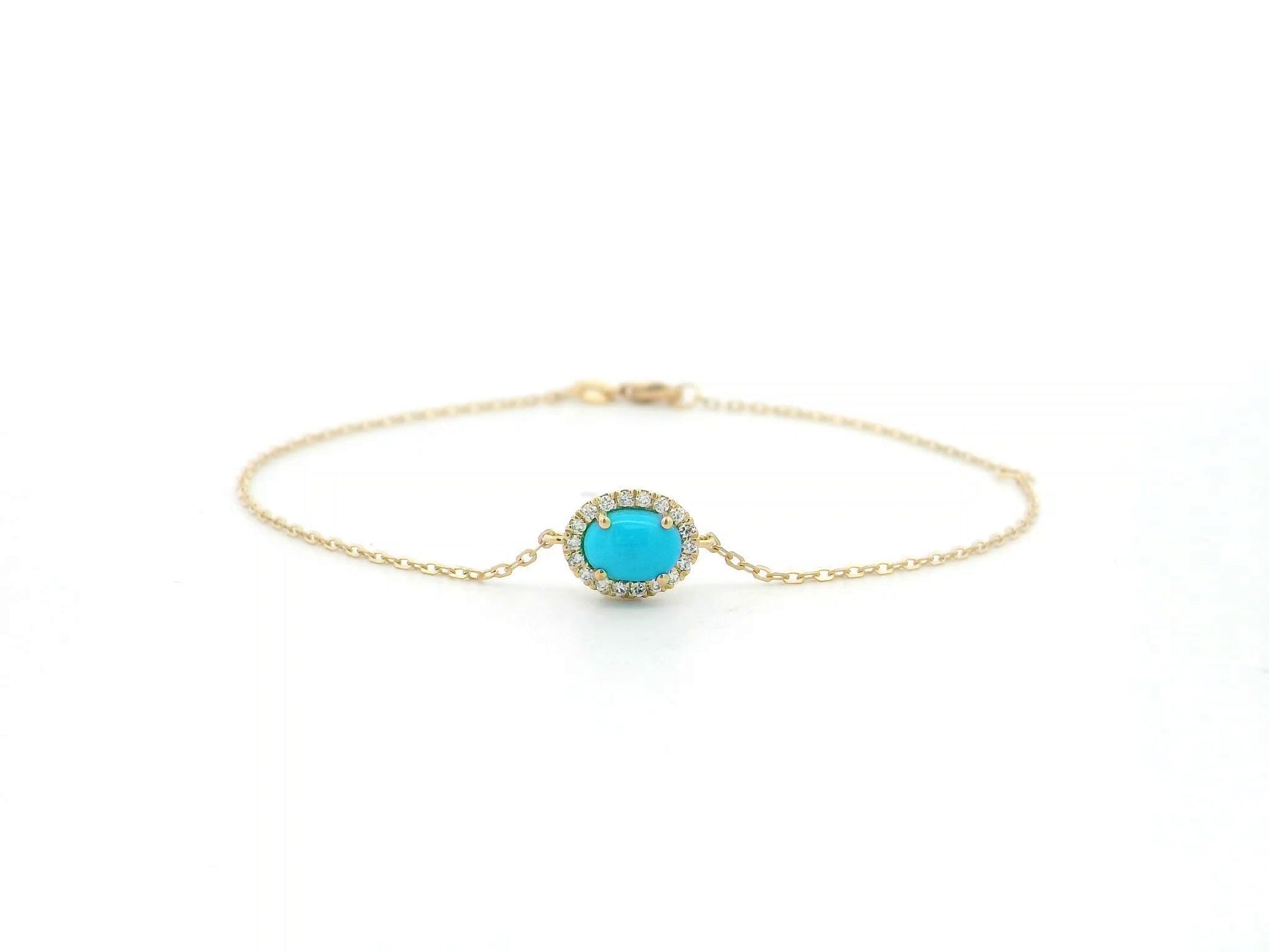 Turquoise diamond halo bracelet in 18K yellow gold with delicate chain by Emirates Diamonds