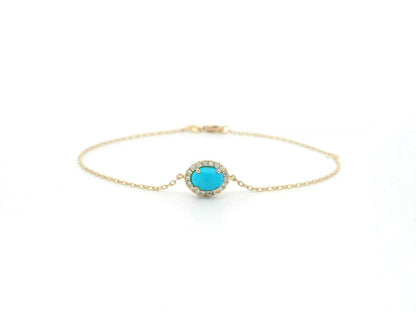 Turquoise diamond halo bracelet in 18K yellow gold with delicate chain by Emirates Diamonds