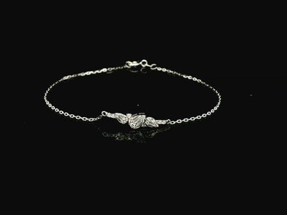 18K white gold diamond bracelet with round and baguette diamond cluster, 0.20 carat minimalist chain – Emirates Diamonds