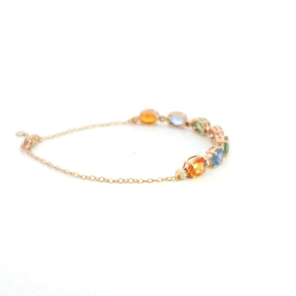 Multi color sapphire and diamond bracelet in 18K rose gold with oval pastel gemstones