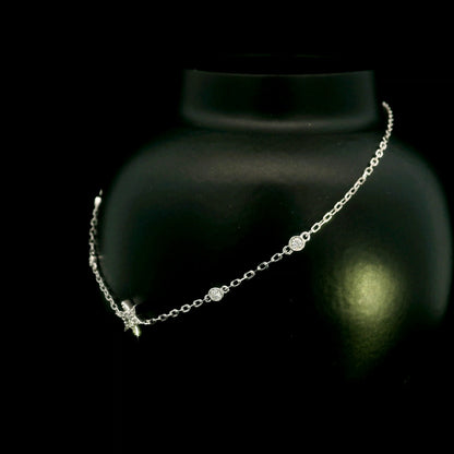 Diamond chain bracelet in 18K white gold featuring a pavé diamond star motif with bezel-set station diamonds totalling 0.16 carat.