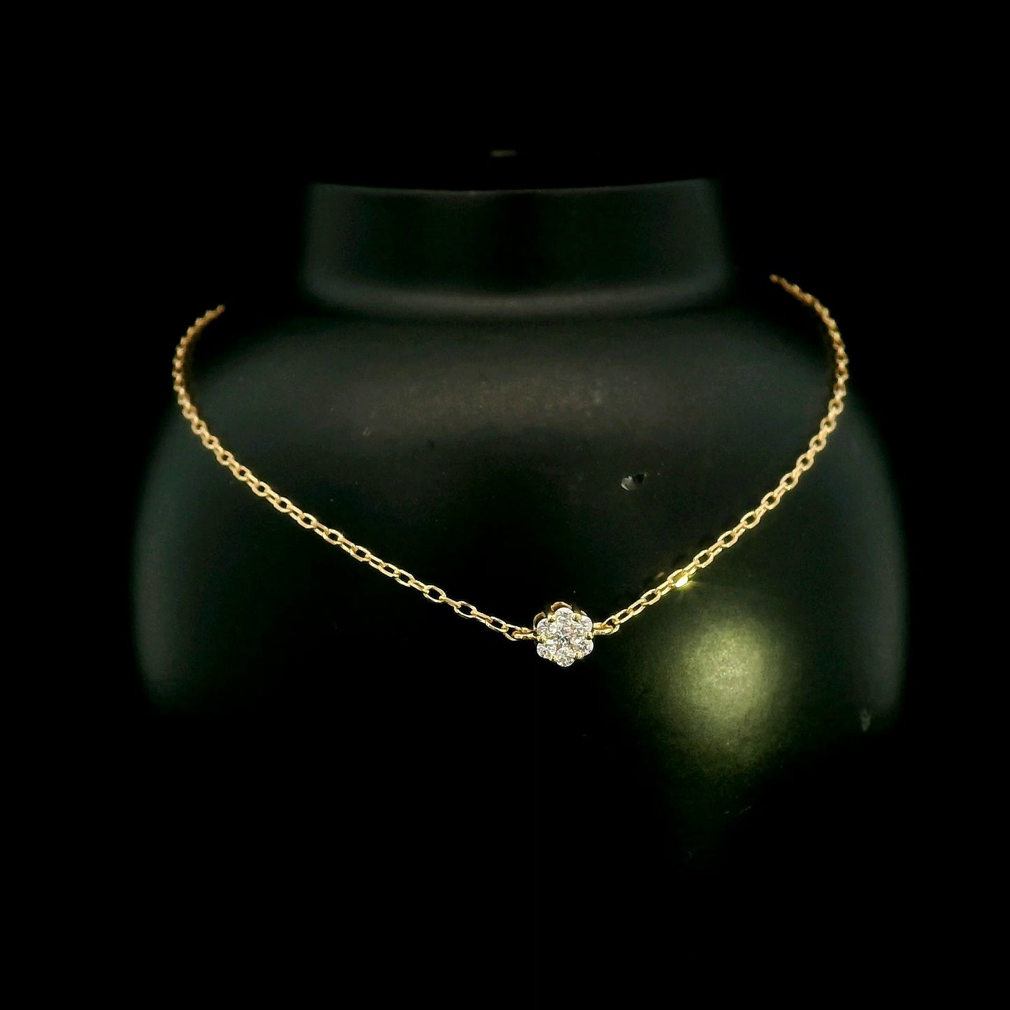 18K yellow gold diamond flower bracelet featuring a natural diamond floral motif on a delicate chain.