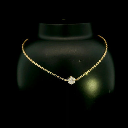 18K yellow gold diamond flower bracelet featuring a natural diamond floral motif on a delicate chain.