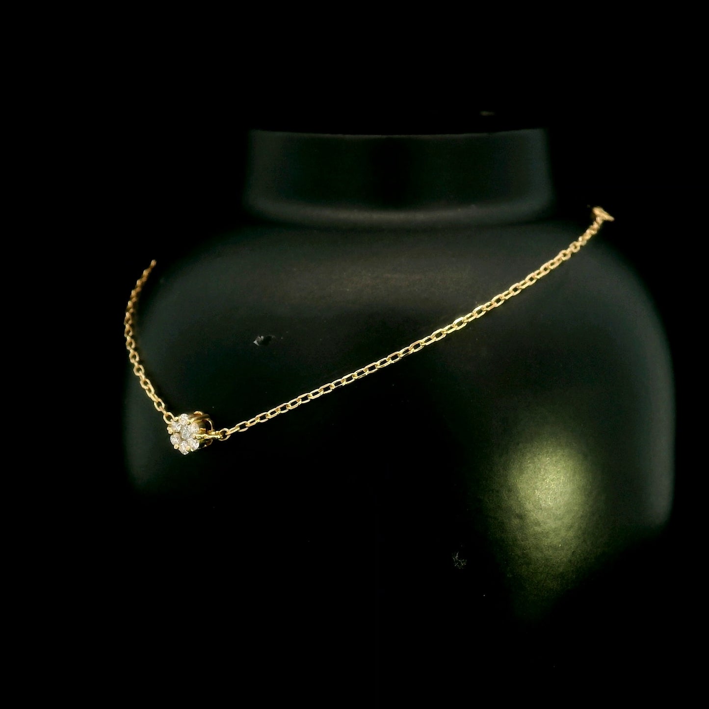 18K yellow gold diamond flower bracelet featuring a natural diamond floral motif on a delicate chain.