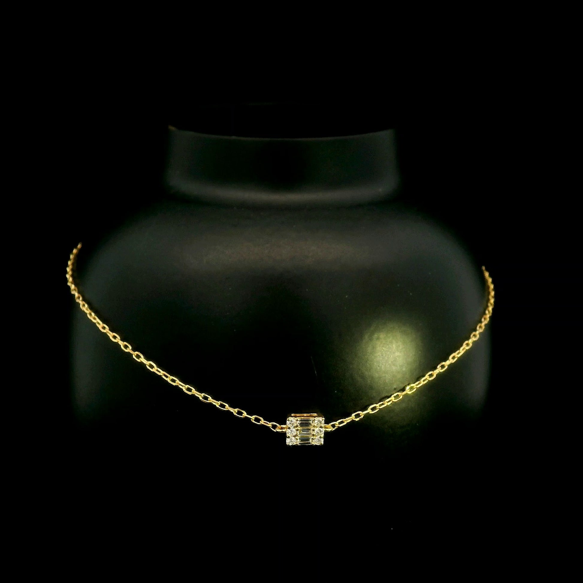 18K yellow gold bracelet with baguette and round natural diamonds in a geometric centre design on a fine adjustable chain