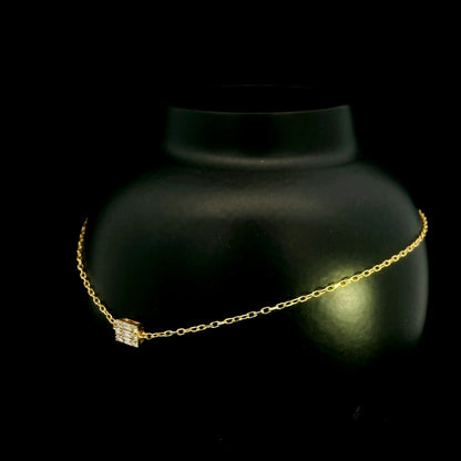 18K yellow gold bracelet with baguette and round natural diamonds in a geometric centre design on a fine adjustable chain