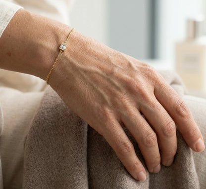18K yellow gold bracelet with baguette and round natural diamonds in a geometric centre design on a fine adjustable chain