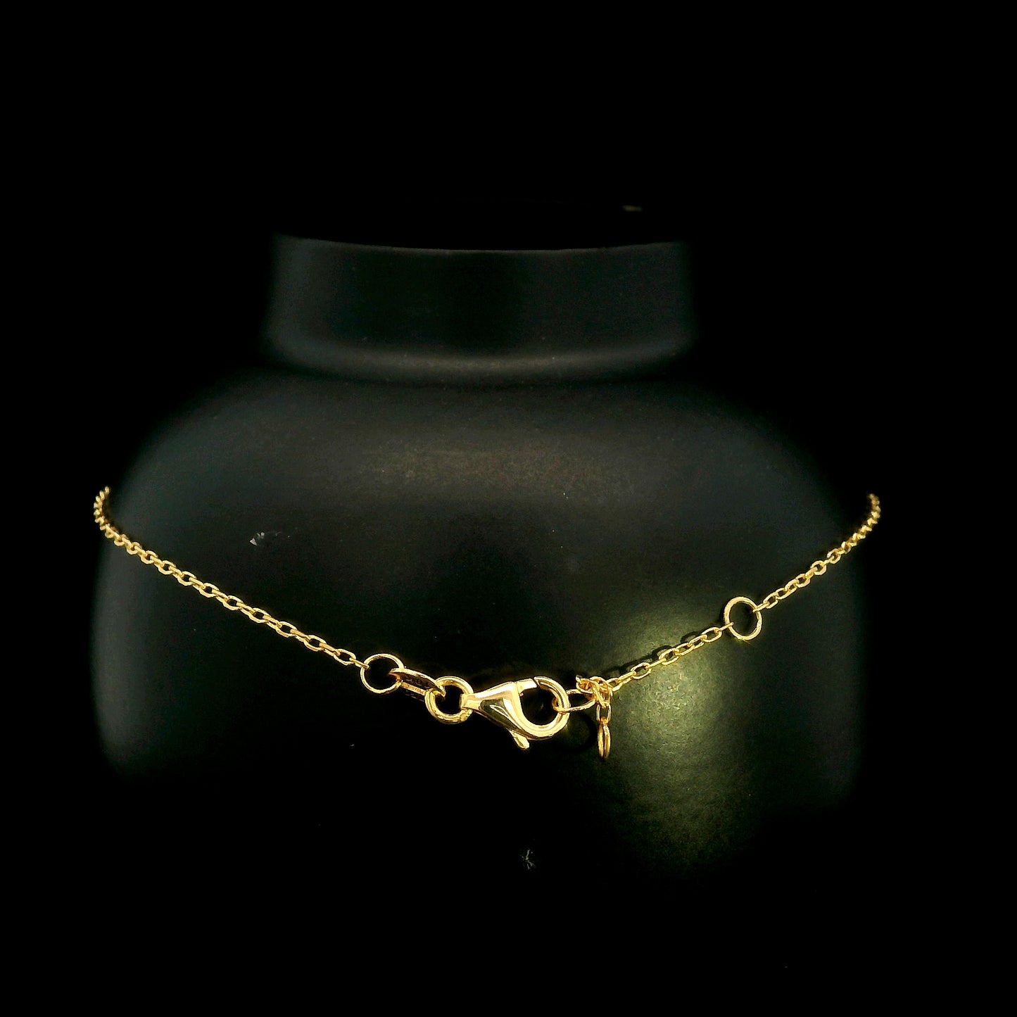 18K yellow gold bracelet with baguette and round natural diamonds in a geometric centre design on a fine adjustable chain