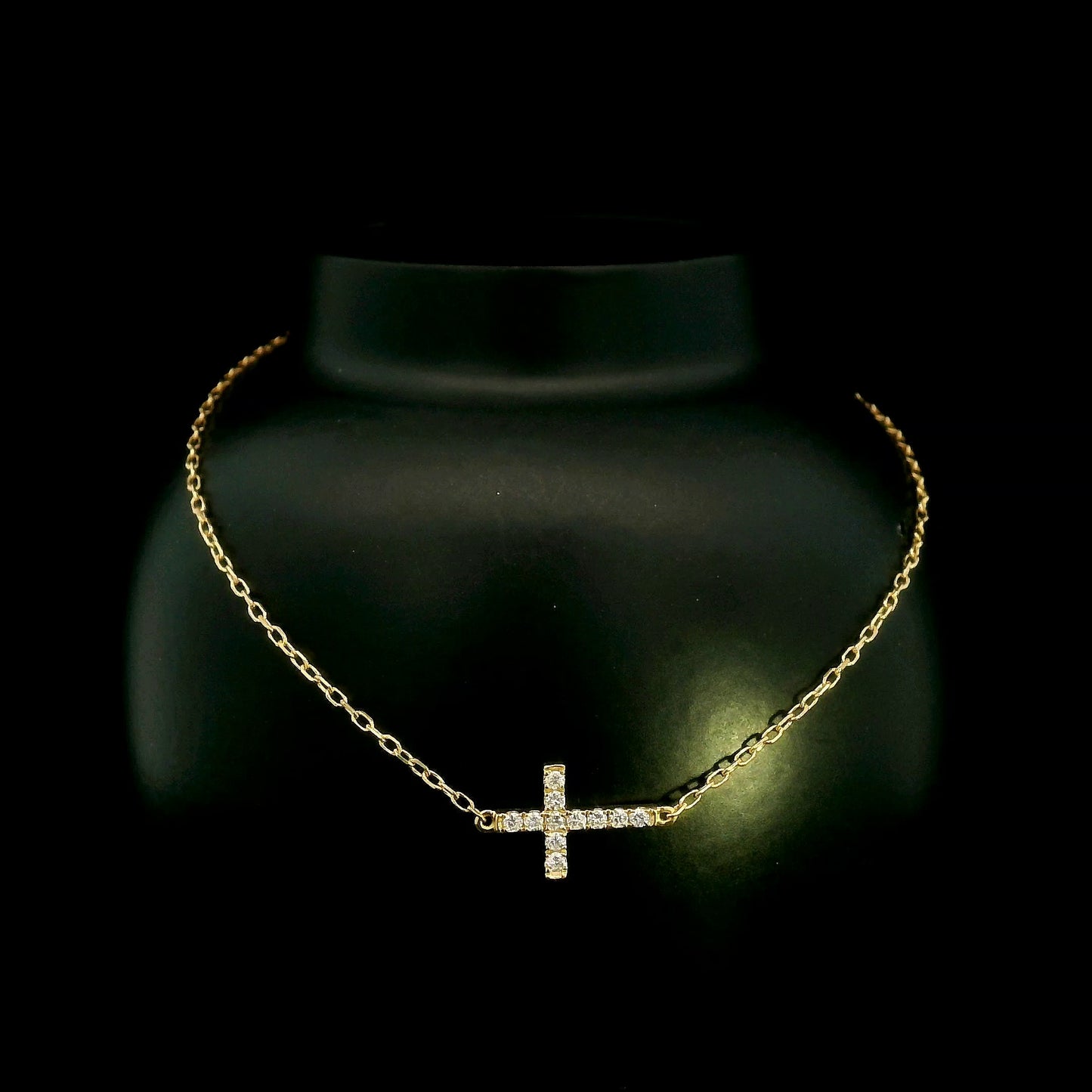 18K yellow gold sideways diamond cross bracelet with round natural diamonds and adjustable fine gold chain