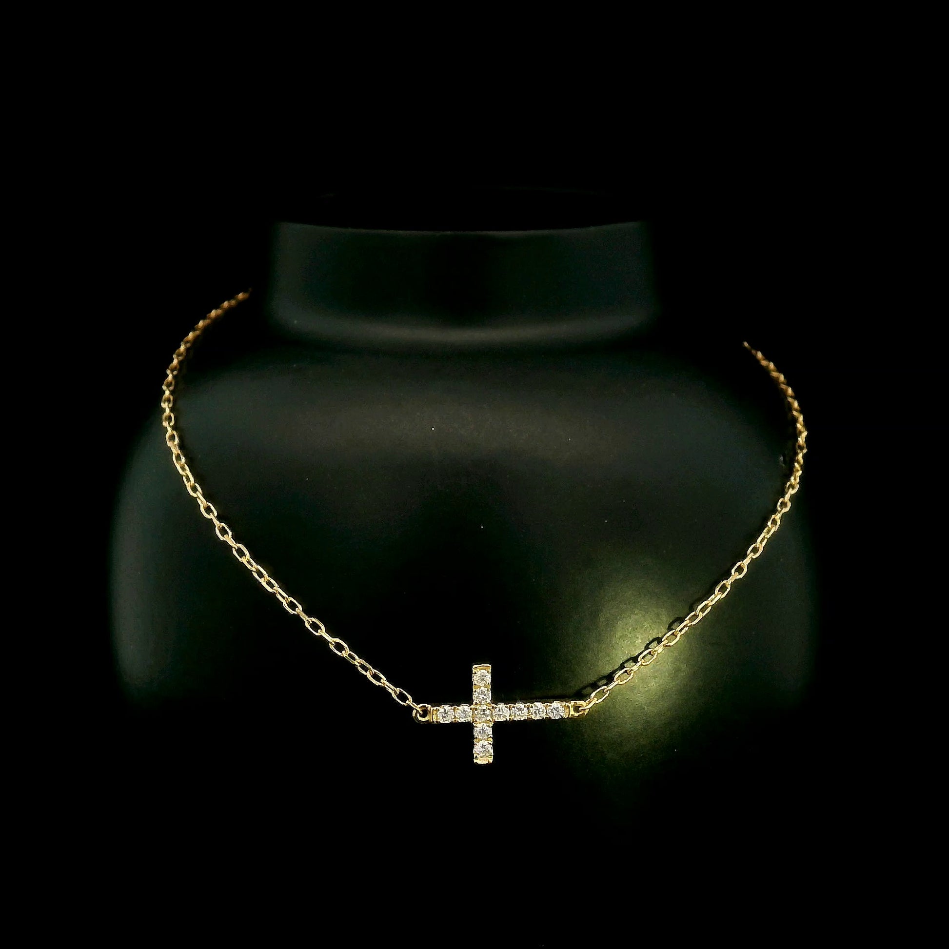 18K yellow gold sideways diamond cross bracelet with round natural diamonds and adjustable fine gold chain