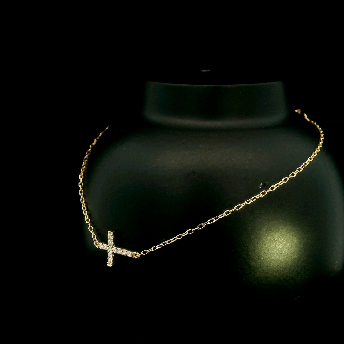 18K yellow gold sideways diamond cross bracelet with round natural diamonds and adjustable fine gold chain