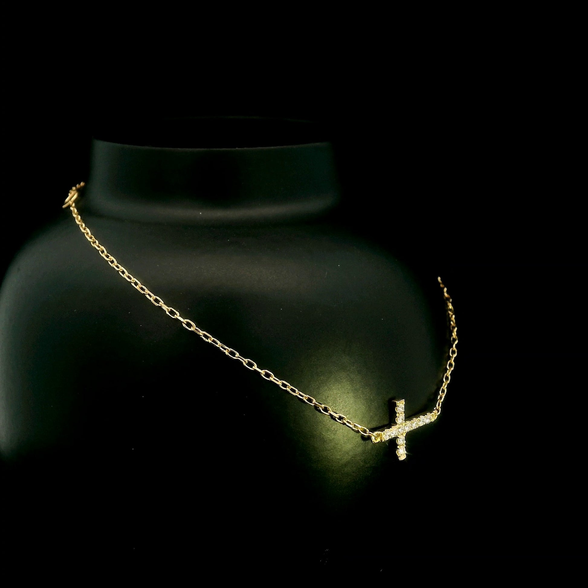 18K yellow gold sideways diamond cross bracelet with round natural diamonds and adjustable fine gold chain