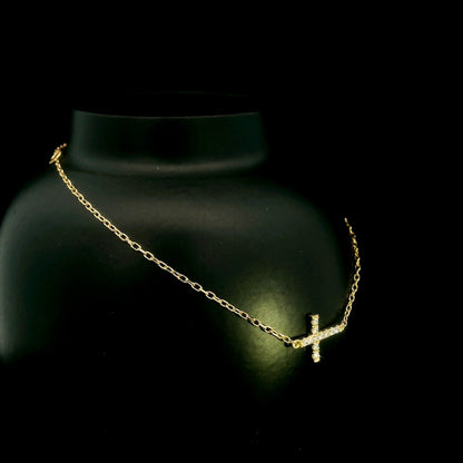 18K yellow gold sideways diamond cross bracelet with round natural diamonds and adjustable fine gold chain