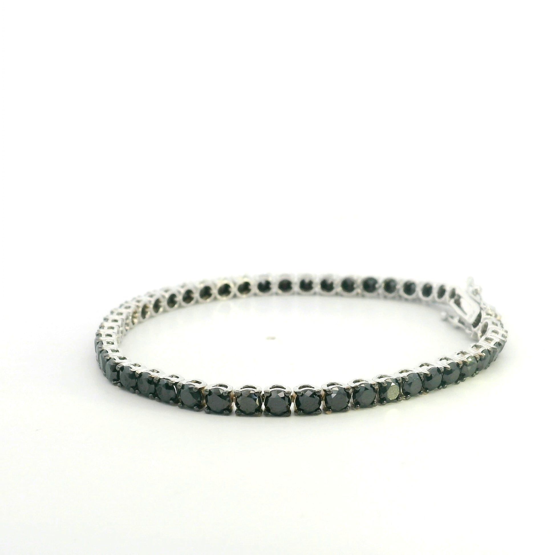 18K white gold black diamond tennis bracelet featuring a continuous row of round natural black diamonds totaling 8.38 carats