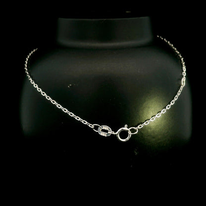 Diamond bar bracelet in 18K white gold featuring a curved row of round brilliant diamonds on a fine chain.