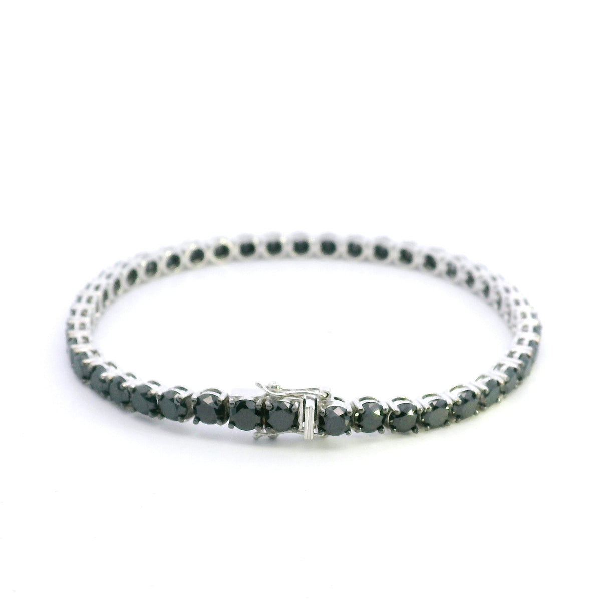 Black diamond tennis bracelet in 18K white gold with a continuous single row of round black diamonds