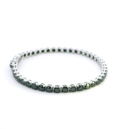 Black diamond tennis bracelet in 18K white gold with a continuous single row of round black diamonds