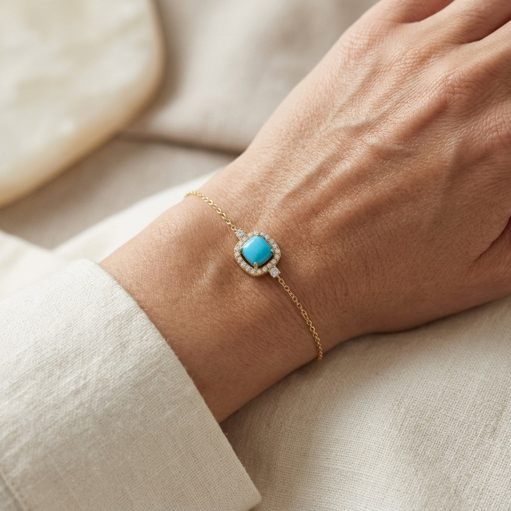 18K yellow gold turquoise and diamond bracelet with cushion-shaped turquoise cabochon, diamond halo and diamond side accents