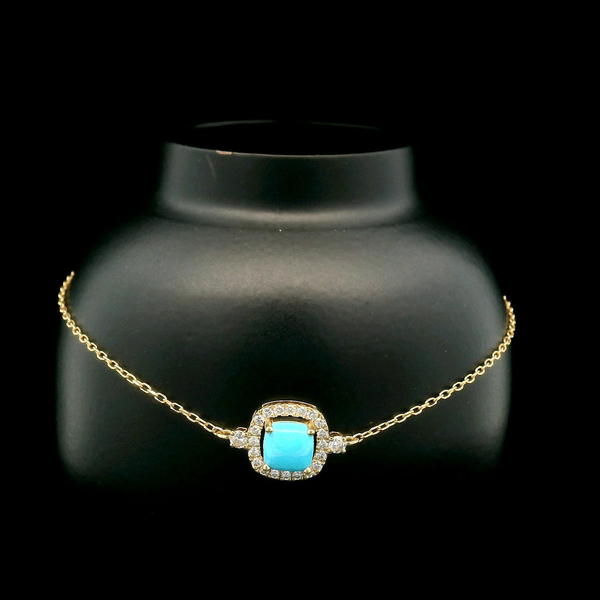 18K yellow gold turquoise and diamond bracelet with cushion-shaped turquoise cabochon, diamond halo and diamond side accents