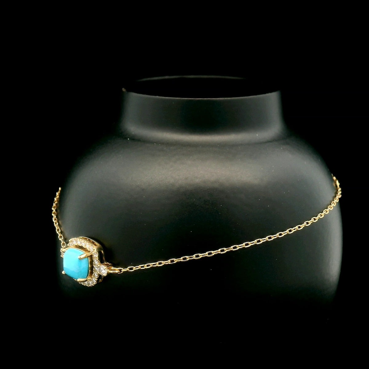 18K yellow gold turquoise and diamond bracelet with cushion-shaped turquoise cabochon, diamond halo and diamond side accents