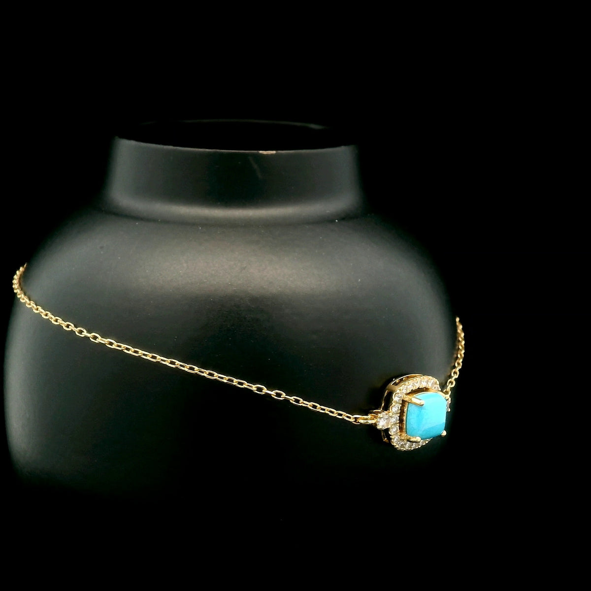 18K yellow gold turquoise and diamond bracelet with cushion-shaped turquoise cabochon, diamond halo and diamond side accents