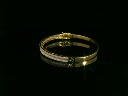 Round and baguette diamond bangle bracelet in 18K yellow gold with 1.57 carats of diamonds by Emirates Diamonds