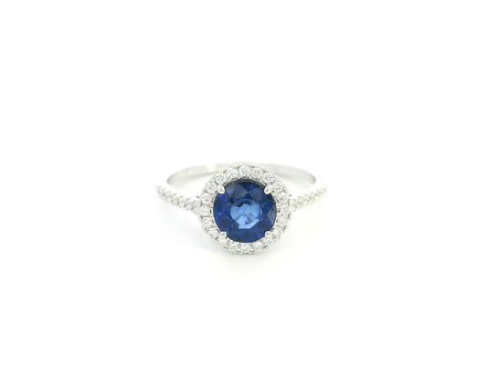 Blue sapphire halo ring with diamonds in 18K white gold by Emirates Diamonds