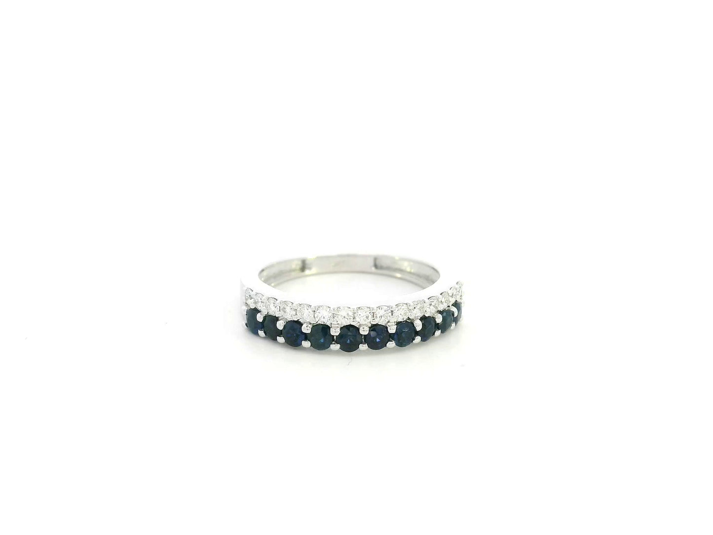 Blue sapphire and diamond band ring in 18K white gold featuring 0.62 carats of sapphires and 0.25 carats of diamonds by Emirates Diamonds.