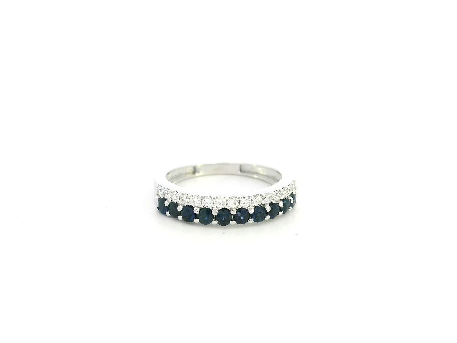 Blue sapphire and diamond band ring in 18K white gold featuring 0.62 carats of sapphires and 0.25 carats of diamonds by Emirates Diamonds.