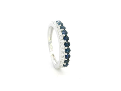 Blue sapphire and diamond band ring in 18K white gold featuring 0.62 carats of sapphires and 0.25 carats of diamonds by Emirates Diamonds.