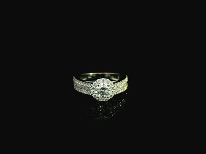 GIA certified 0.60 carat diamond halo engagement ring in 18K white gold with pavé diamond band by Emirates Diamonds