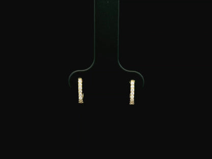 18K yellow gold diamond huggie hoop earrings featuring 0.09 carats of natural diamonds in a classic everyday hoop design.