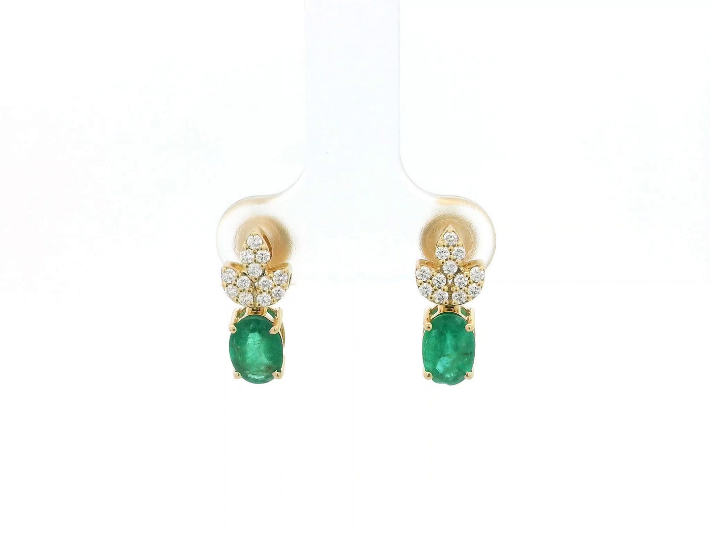 Emerald and diamond accent earrings in 18K yellow gold featuring 1.14 carat emeralds and 0.19 carat diamonds by Emirates Diamonds.
