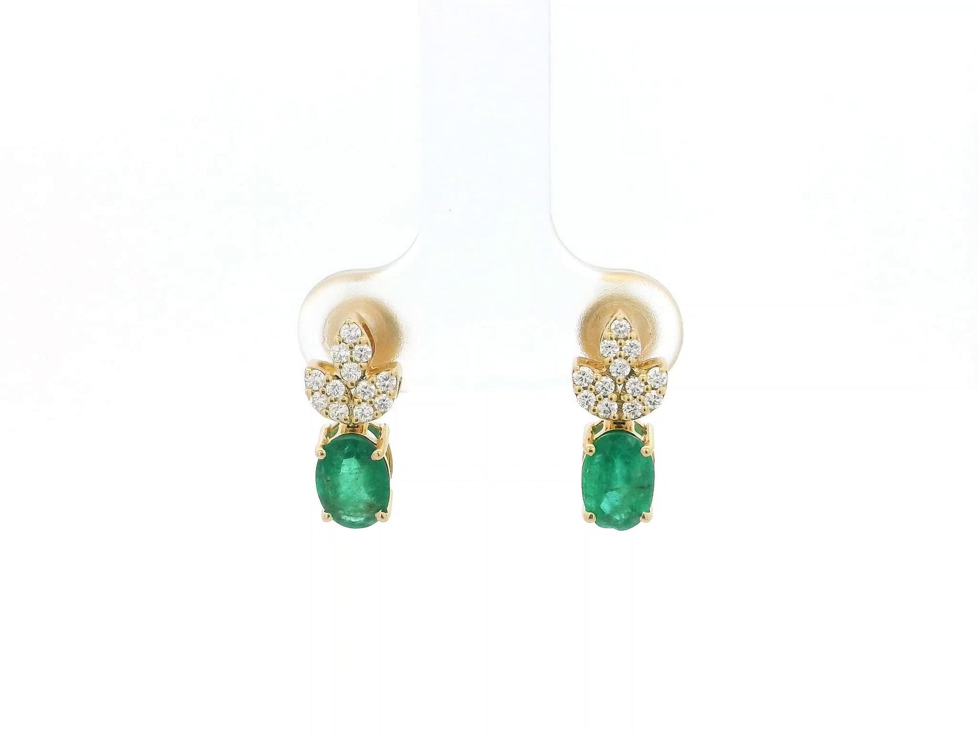 Emerald and diamond accent earrings in 18K yellow gold featuring 1.14 carat emeralds and 0.19 carat diamonds by Emirates Diamonds.