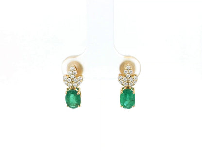 Emerald and diamond accent earrings in 18K yellow gold featuring 1.14 carat emeralds and 0.19 carat diamonds by Emirates Diamonds.
