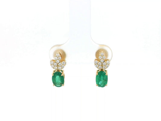 Emerald and diamond accent earrings in 18K yellow gold featuring 1.14 carat emeralds and 0.19 carat diamonds by Emirates Diamonds.