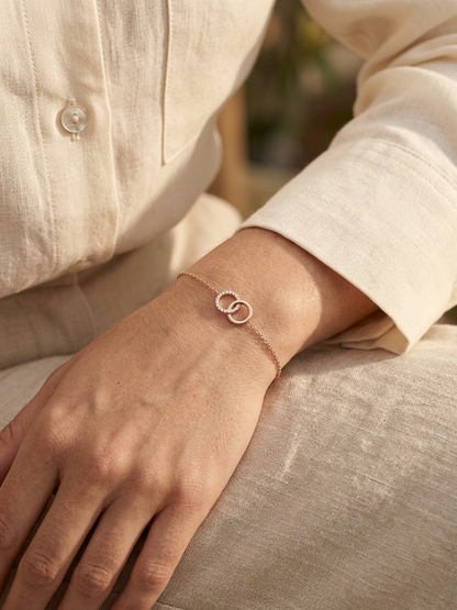 Diamond circle link bracelet in 18K rose gold with pavé diamonds by Emirates Diamonds