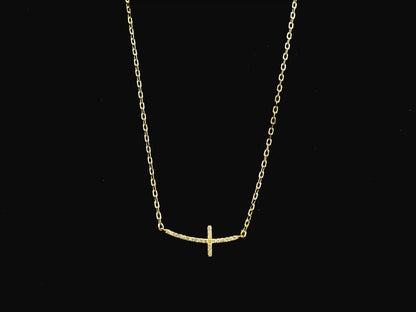Diamond cross necklace in 18K yellow gold featuring 0.06 carats of diamonds by Emirates Diamonds.