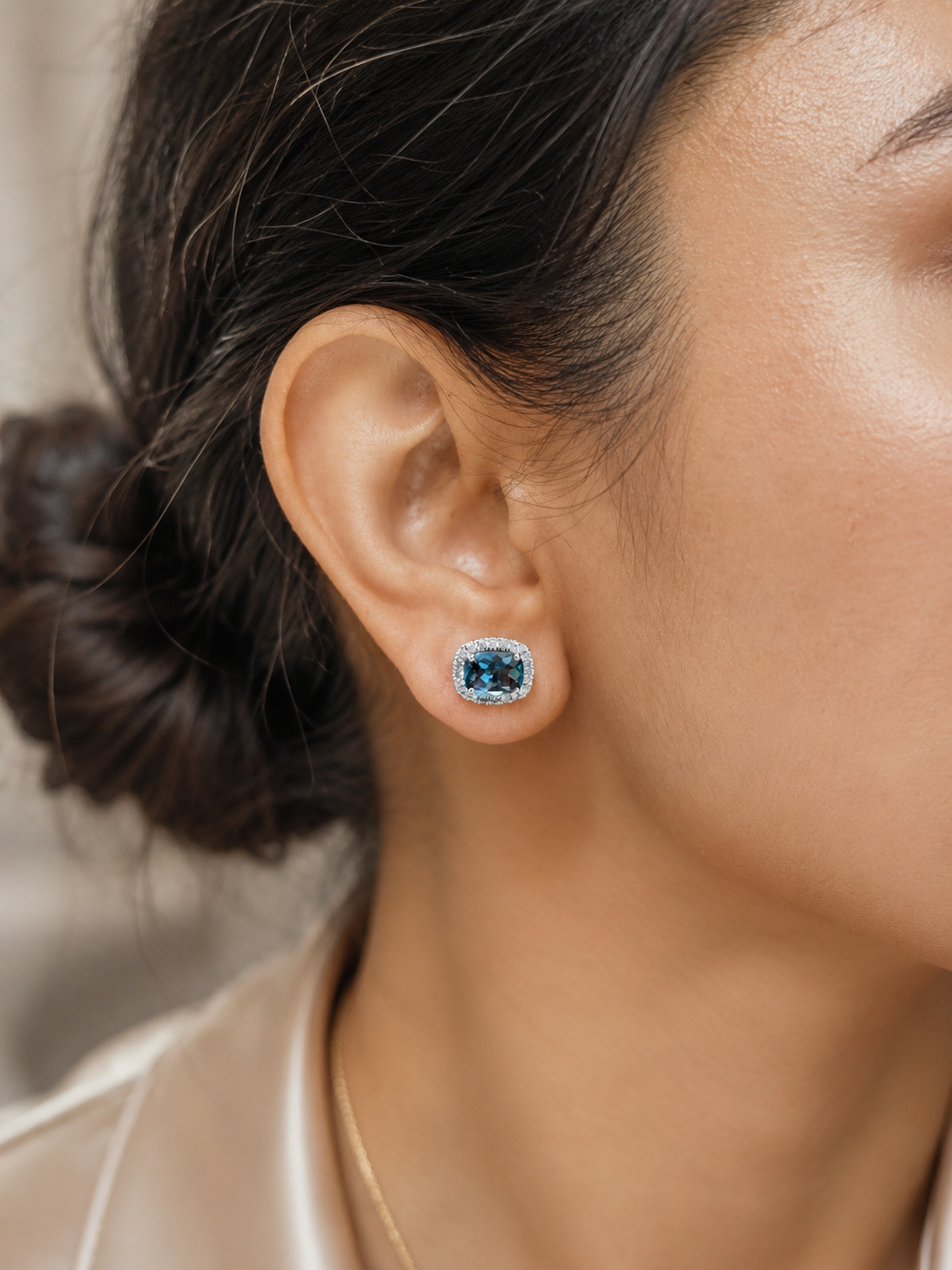 18K White Gold London Blue Topaz Diamond Halo Stud Earrings featuring 3.54 carats of natural London Blue Topaz and 0.40 carats of natural diamonds.