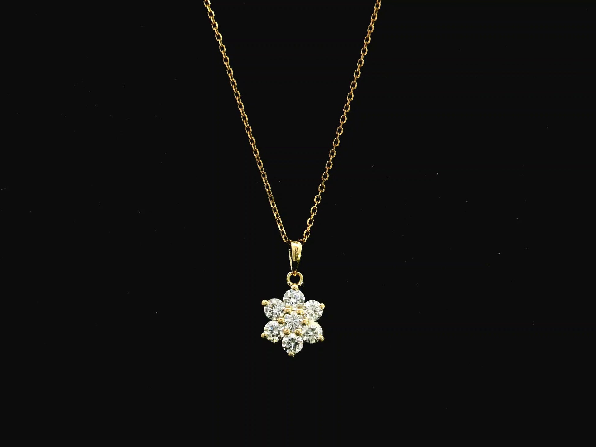 Diamond flower cluster pendant in 18K yellow gold featuring 0.55 carats of diamonds by Emirates Diamonds.