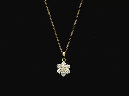Diamond flower cluster pendant in 18K yellow gold featuring 0.55 carats of diamonds by Emirates Diamonds.