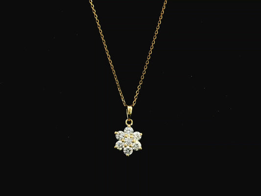 Diamond flower cluster pendant in 18K yellow gold featuring 0.55 carats of diamonds by Emirates Diamonds.