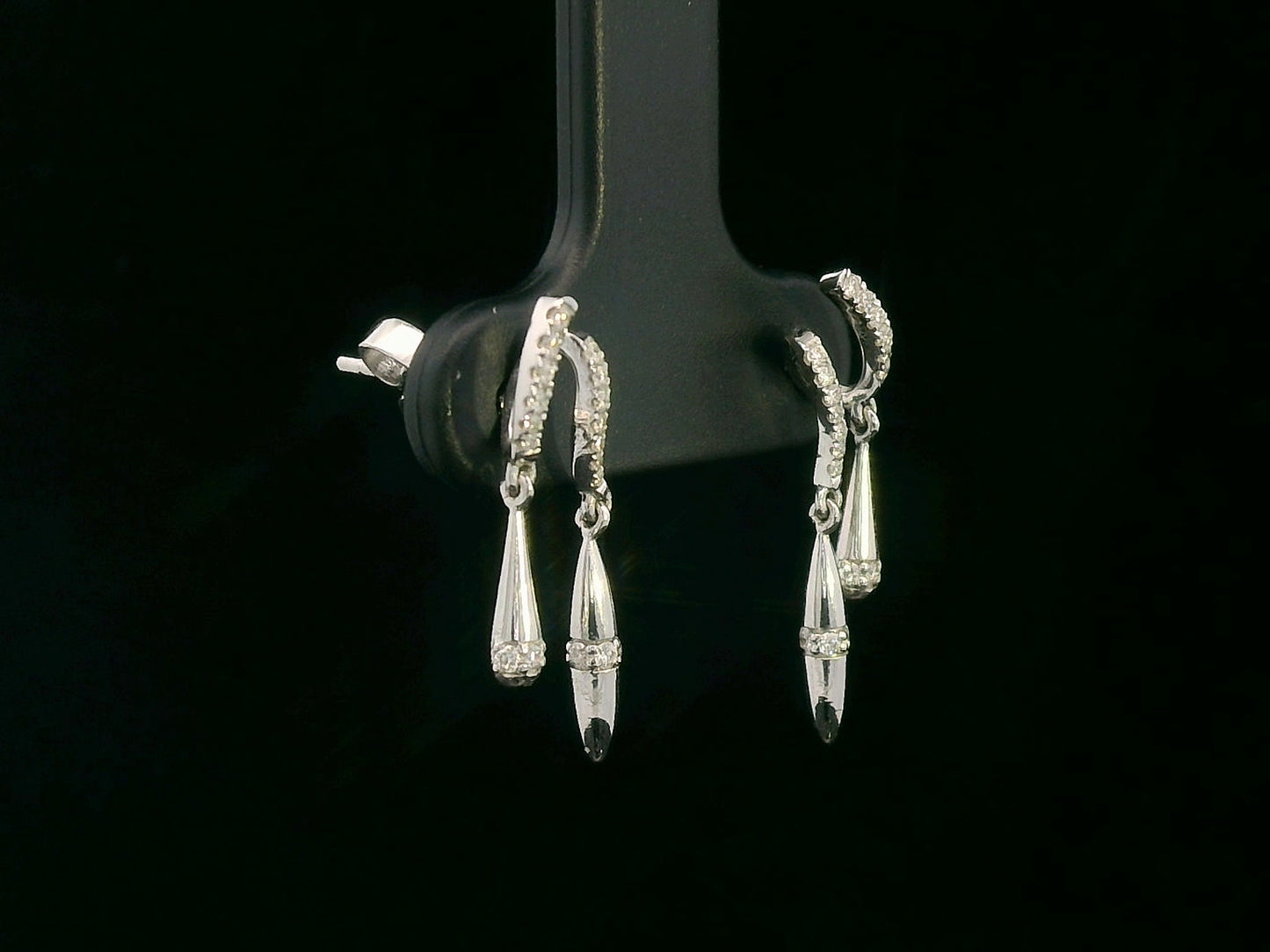 Luxury 18K gold diamond drop earrings with twisting design and dangling accents – 0.16 carat diamonds