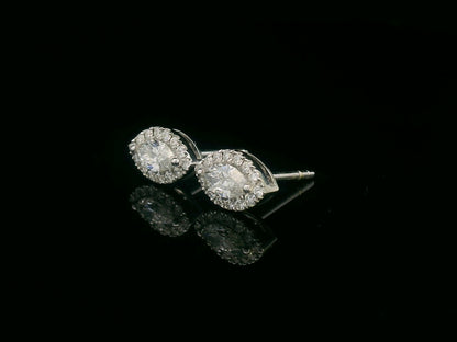 18K gold marquise diamond halo stud earrings with round-cut diamond accents – 0.69 carat total weight

