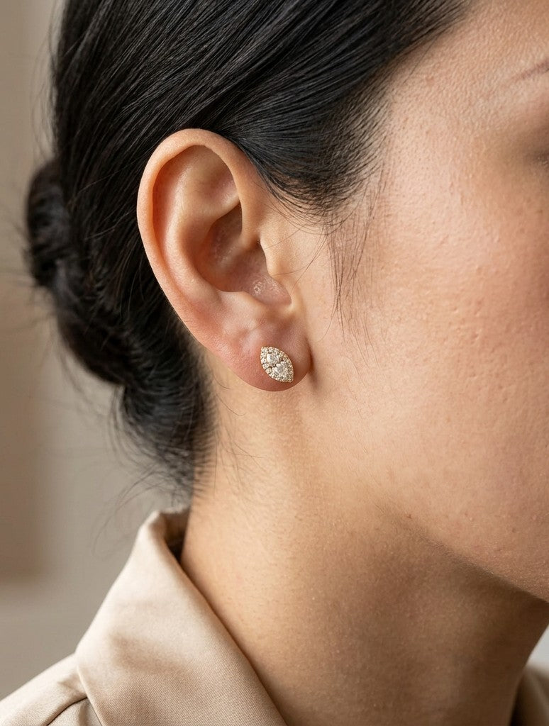Marquise diamond halo stud earrings in 18K white gold with natural marquise centre diamonds surrounded by round brilliant diamonds